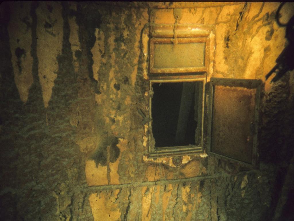 A porthole on the side of the Titanic in an image from the historic 1986 dive. Picture: AFP