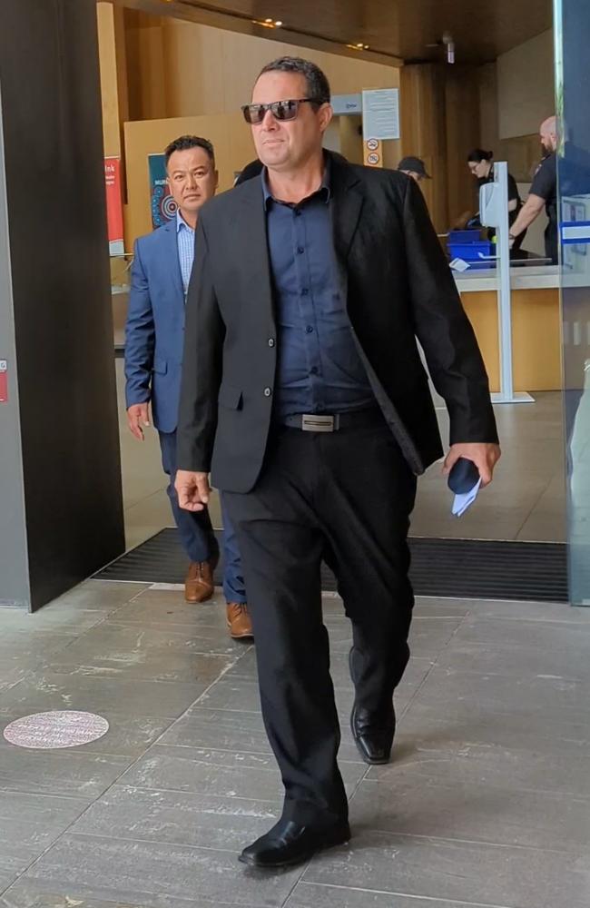 Julian Mark Jonic (wearing black suit and sunglasses) leaves Ipswich Court on October 4, 2023. Picture: Nicola McNamara