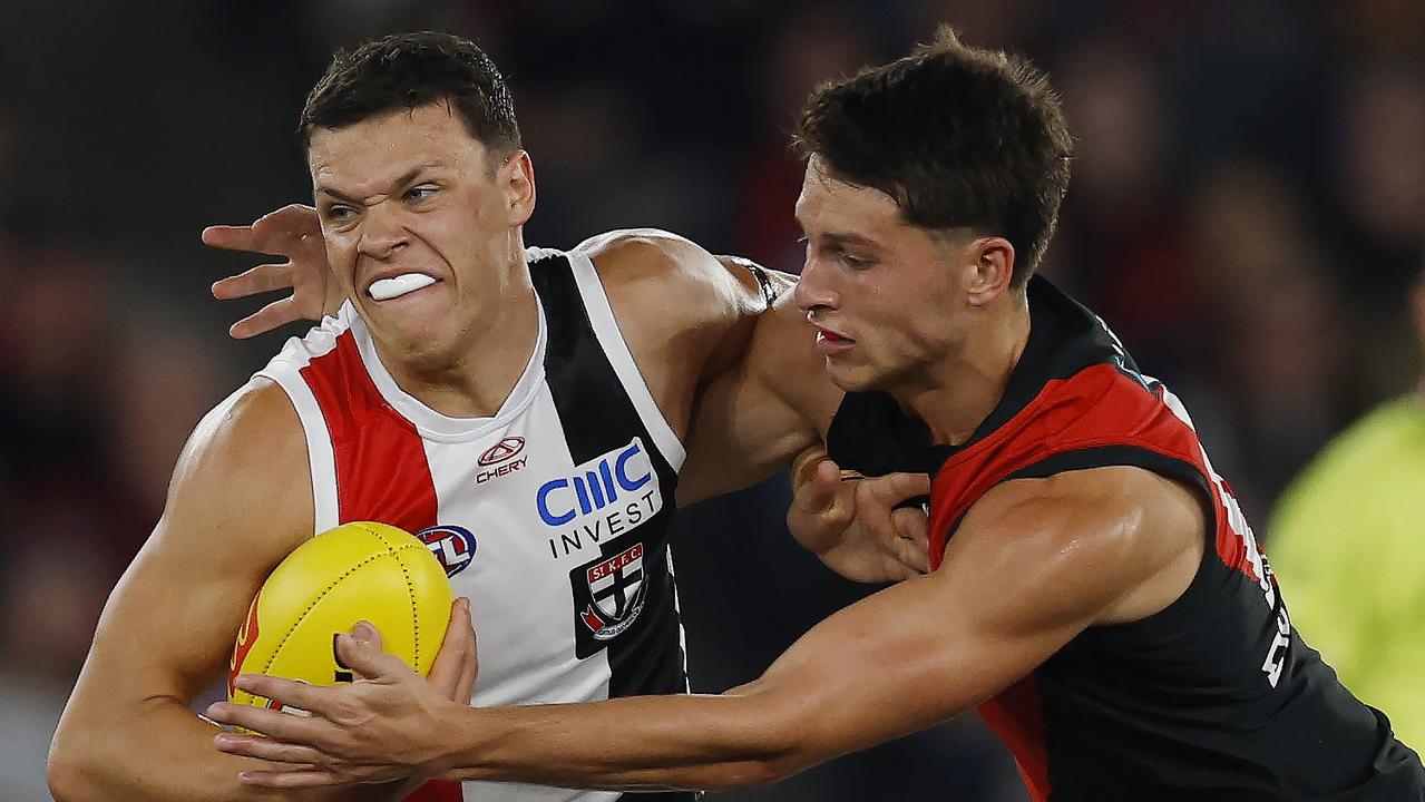 MELBOURNE , AUSTRALIA. March 30, 2024. AFL Round 3. Essendon vs St Kilda at Marvel Stadium. Marcus Windhager of the Saints tackled by Archie Perkins of the Bombers during the 2nd qtr. . Pic: Michael Klein