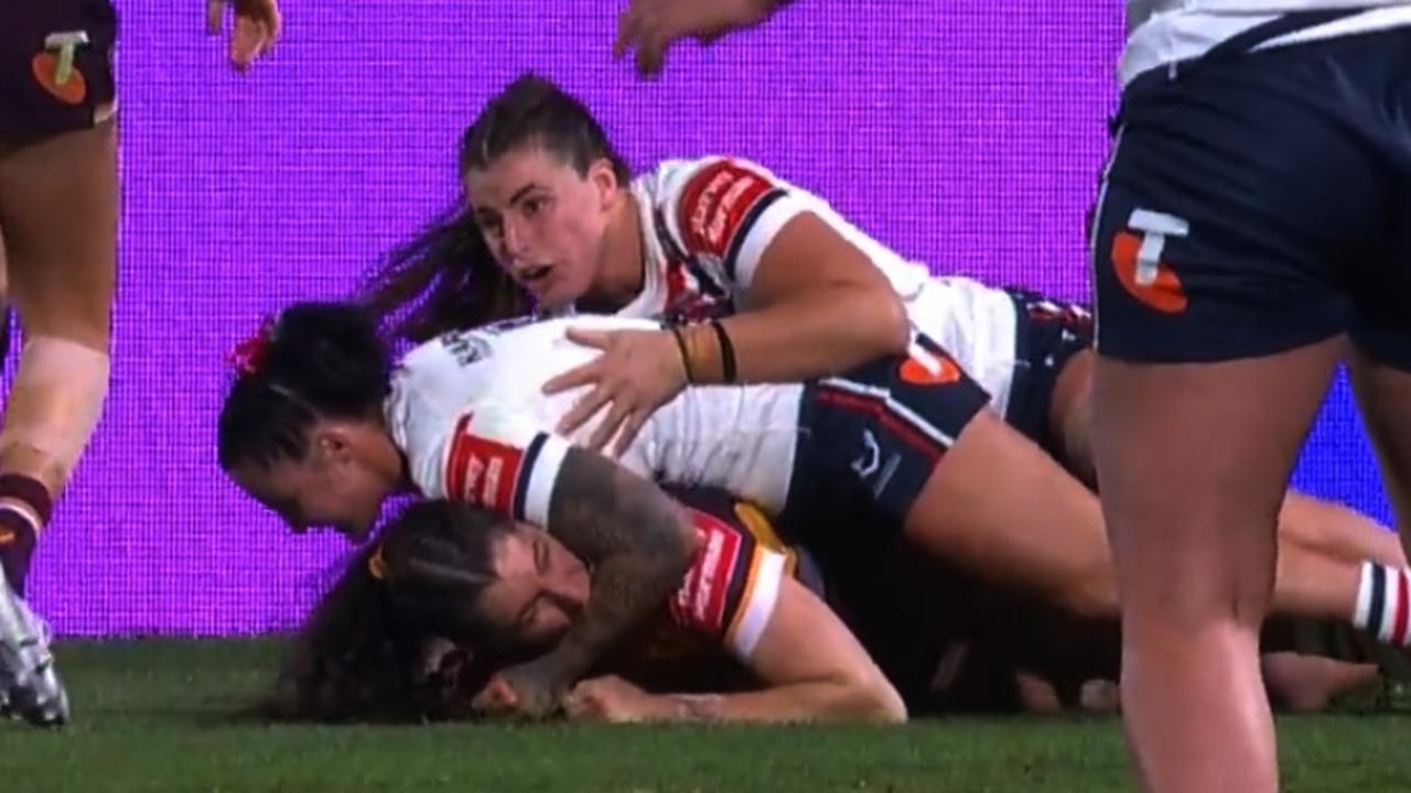 Broncos winger Ashleigh Werner is sent off last night for this alleged bite on her Sydney Roosters opposite Jayme Fressard.