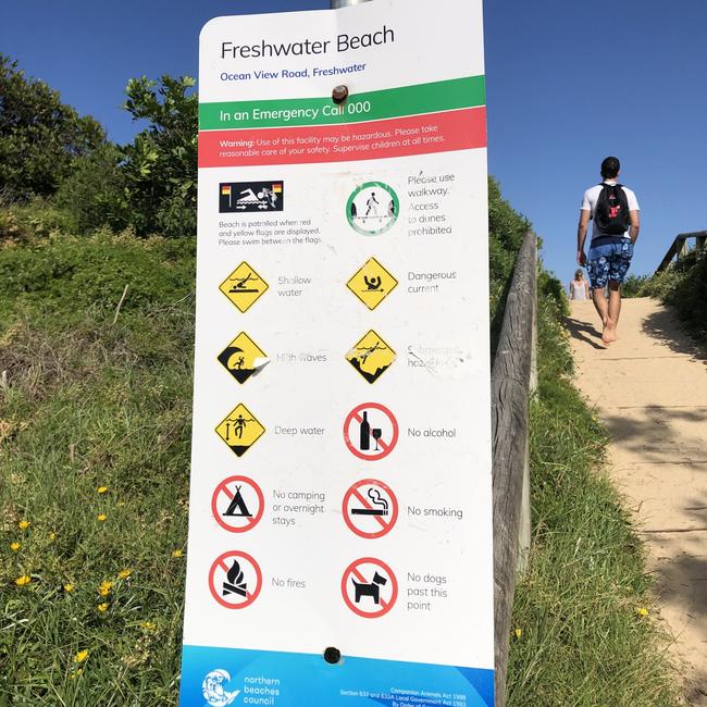 A sign, installed by Northern Beaches Council at Freshwater Beach, showing a number of danger warnings and activities that are banned on the beach. Picture: Jim O'Rourke