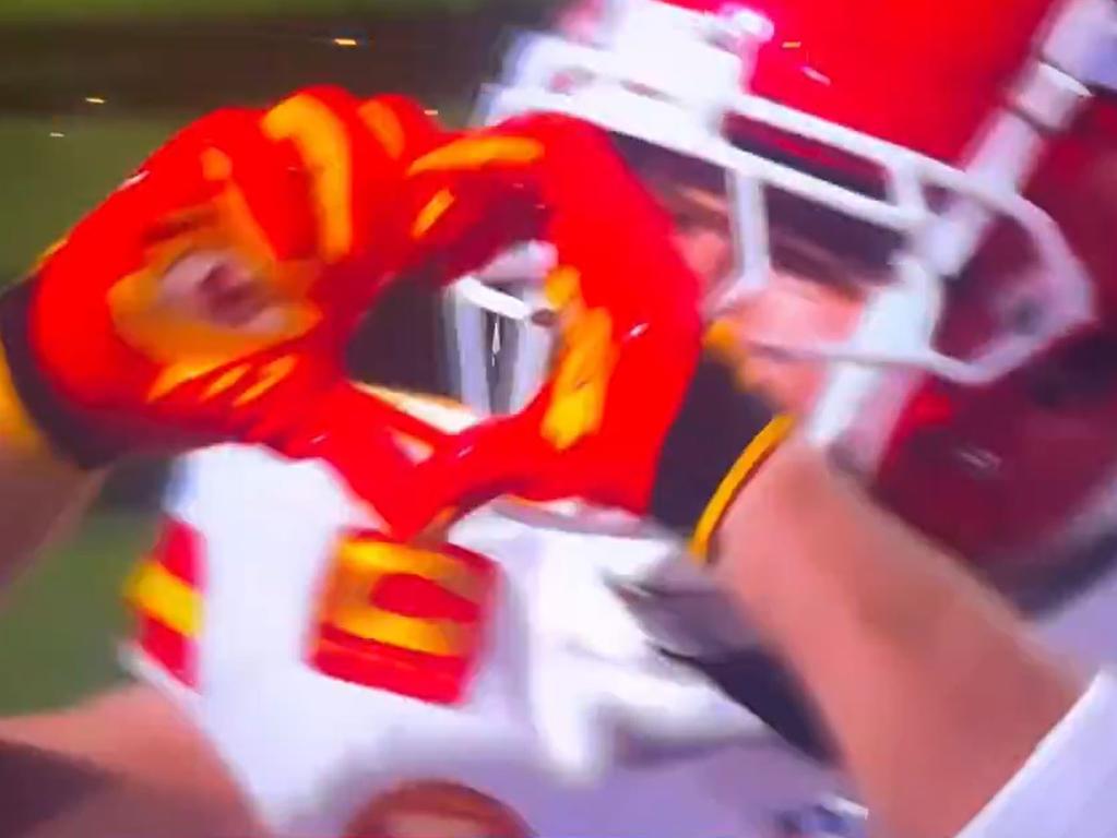 Travis Kelce signals to his girl in the stands.