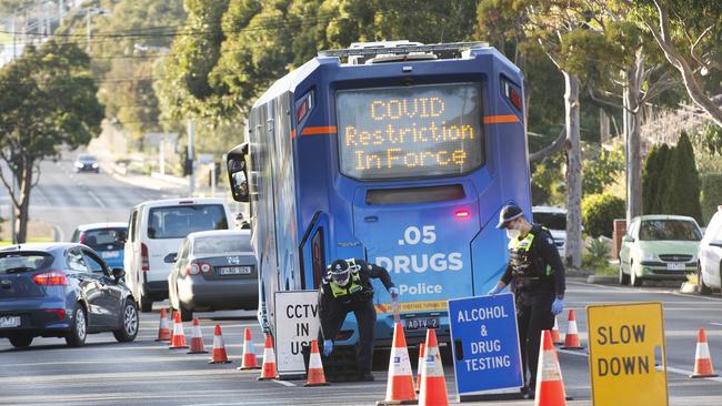 Booze bus-style checkpoints have been set up in locked down areas. Picture: Rob Leeson.