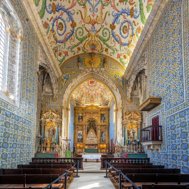 Altar and aisle of Saint Michaels Chapel (Capela de Sao Miguel) at University of Coimbra.