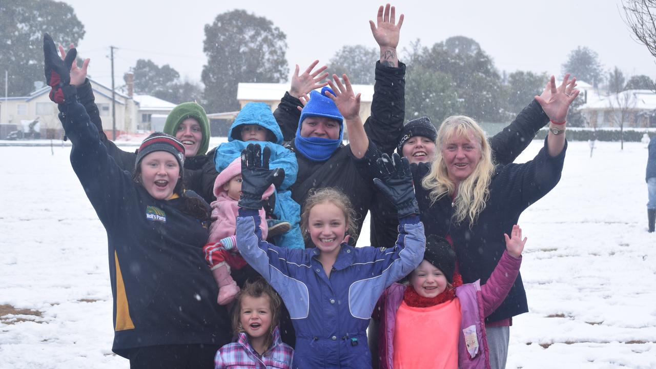 Sally, Cassie and Candy Robinson with Areiellah, Bryan and Kanahri Andrews, Elanie Elara, Taneequa and Phoenix Andrews and Pauline Robinson enjoy the snow in Wallangarra. Photo: Alex Nolan / Stanthorpe Border Post