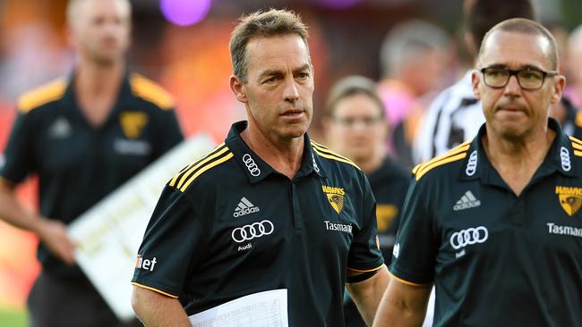 Hawthorn Hawks coach Alastair Clarkson (left) looks on during their Round 3 game against the Gold Coast Suns at Metricon Stadium on the Gold Coast, Sunday, April 9, 2017. (AAP Image/Dan Peled) NO ARCHIVING, EDITORIAL USE ONLY