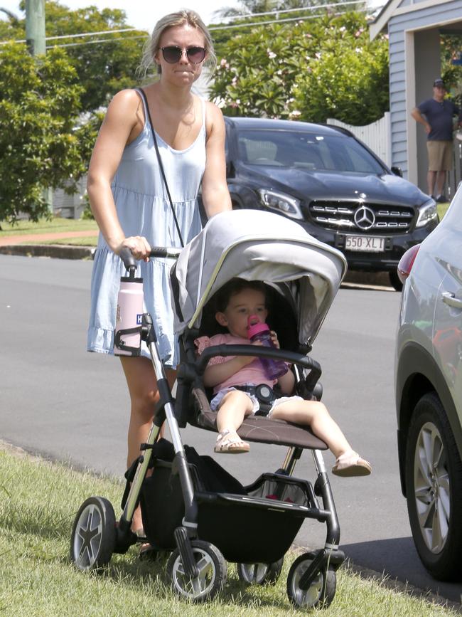 Neighbours at the scene of the horrific incident. Picture: Steve Pohlner