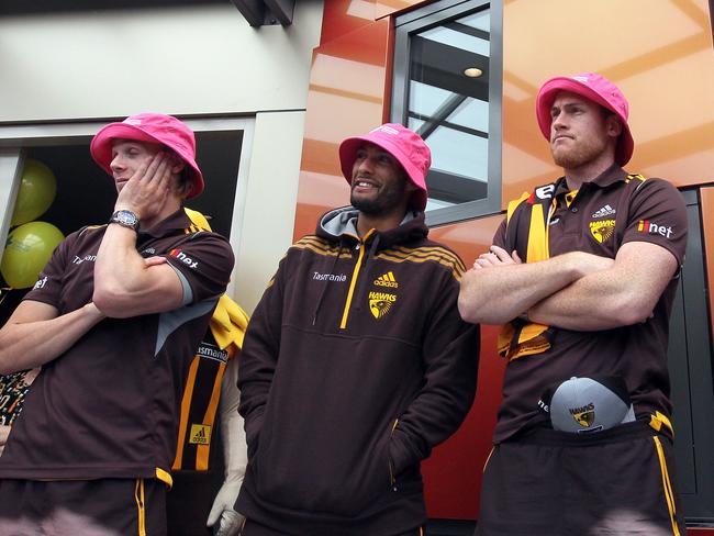 Pink bucket hats were the order of the day for Hawthorn premiership players visiting the Launceston Cancer Support Centre. Picture: ROSS MARSDEN