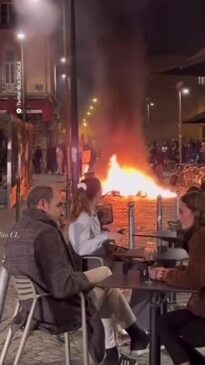 This is fine' viral video shows diners calmly eating as fires rage outside  restaurant in France