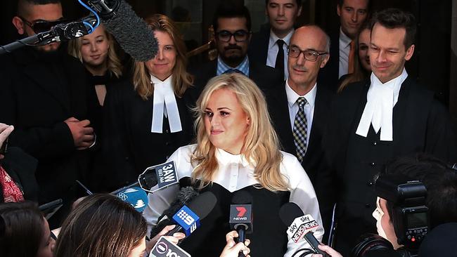 Rebel Wilson speaks to the media as she leaves the Victorian Supreme Court after her defamation win against Bauer Media. Picture: Scott Barbour/Getty Images.