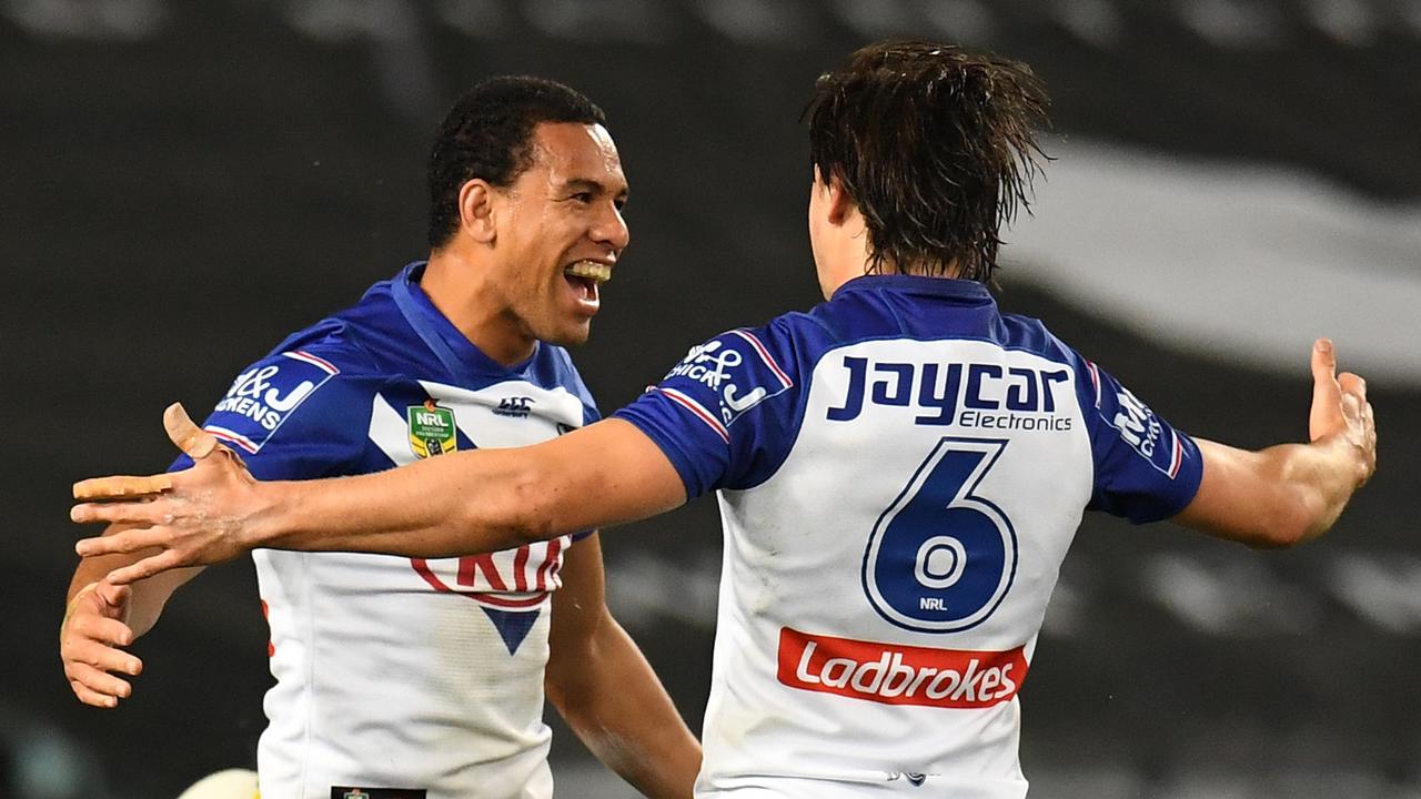 William Hopoate of the Bulldogs celebrates his try with Lachlan Lewis against the Broncos.