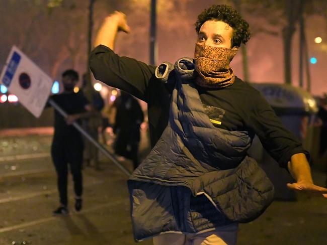 A protester hurls an object at police during the violence. Picture: AFP