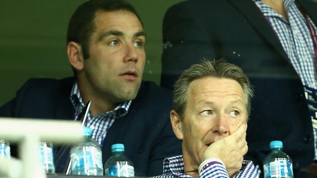 Cameron Smith (L) was forced to look on from the coaching box last week due to suspension.