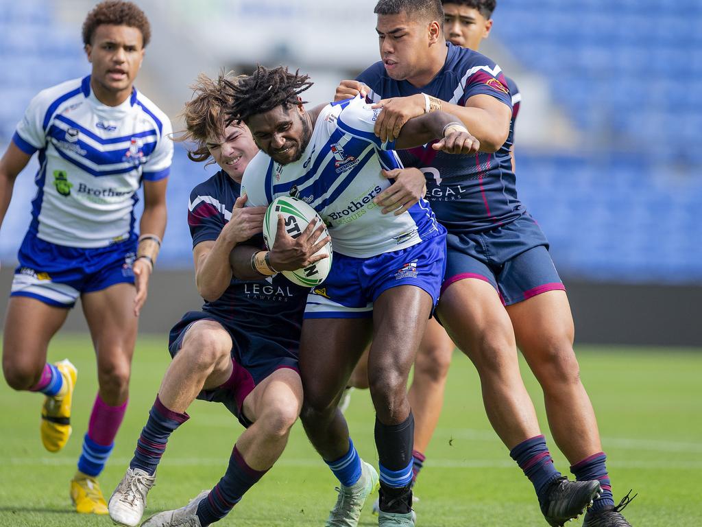 The Grand Final of the Qld schoolboys rugby league competition with Ipswich SHS (Dark blue jersey) playing against Ignatius Park College (white/blue jersey) in the Phil Hall Cup grand final at Cbus Super Stadium on 31 August 2022. Ignatius Park College's Tekelu Mene in action. Picture: Jerad Williams