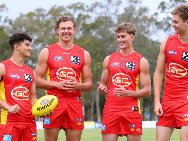 Jake Roger, Jed Walter, Will Graham and Ethan Read pose during a Gold Coast Suns AFL media opportunity at Palm Beach Currumbin Football Club (Photo by Chris Hyde/Getty Images)