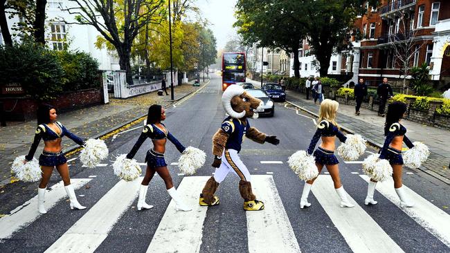 St. Louis Rams cheerleaders and their mascot Rampage pose for photographs on the Abbey Road zebra crossing in London in 2012.