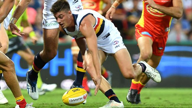 Crows player Riley Knight gathers the ball against the Suns. He’s expected to be available for selection for the clash with North Melbourne. Picture: Dave Hunt (AAP)