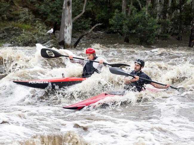 Kayakers take on Dights Falls in Abbotsford after the weekend rain. Picture: Sarah Matray