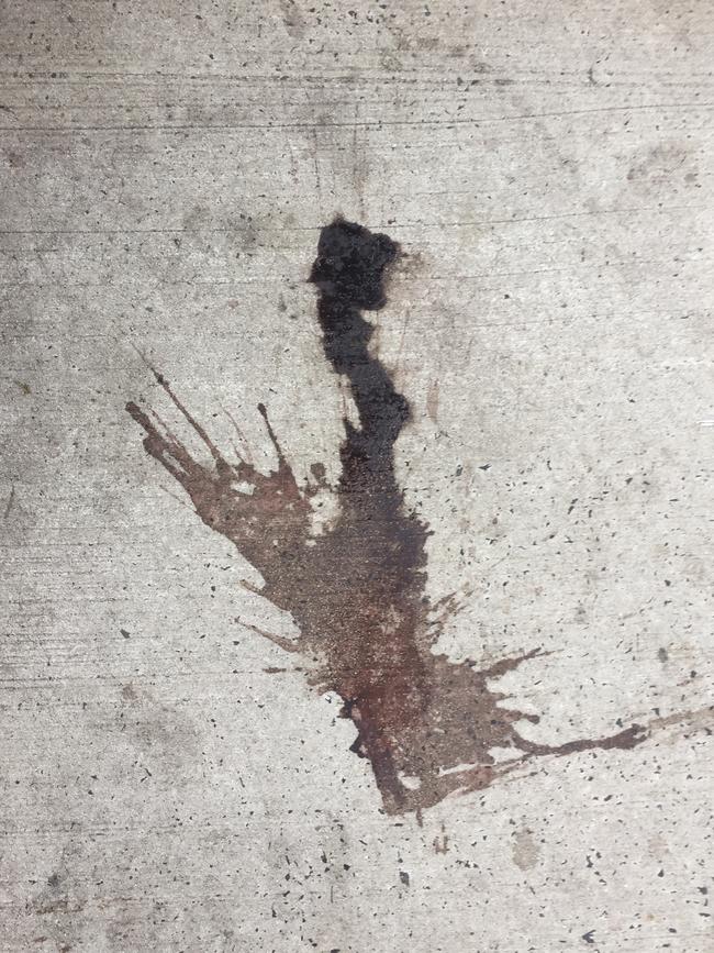 A dark stain on the ground near the scene to a violent brawl earlier this month