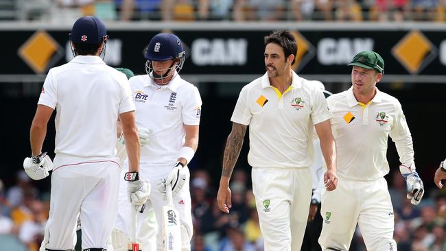 Mitchell Johnson chats to Joe Root during day 4 of the first Ashes Test from the Gabba in Brisbane. Pics Adam Head