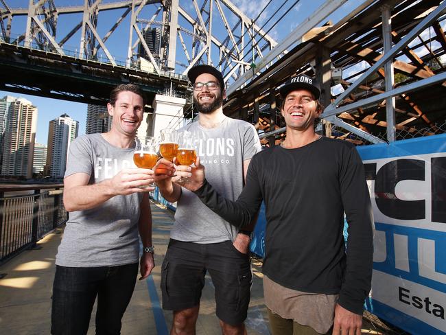 Here’s cheers … general manager Ash Cranston, head brewer Tom Champion and Howard Smith Wharf director Adam Flaskas.