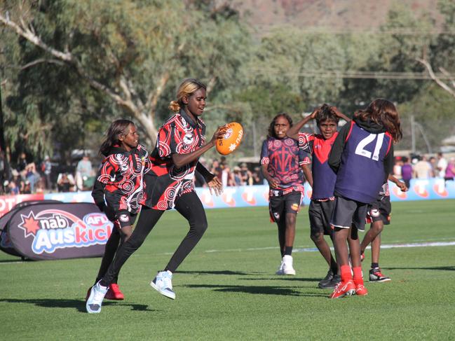 The Auskickers come out at half time at the Demons Saints game at Traeger Park, Alice Springs, June 1, 2025. Picture: Gera Kazakov