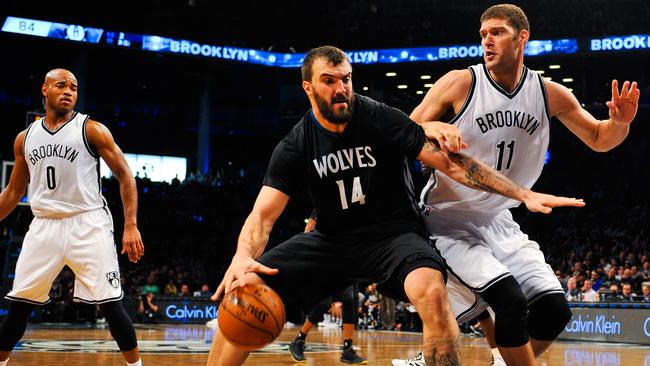 Nikola Pekovic attempts to drive around Brook Lopez #11 of the Brooklyn Nets.