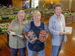 PAGE TURNER: Blue Care Book Sale Coordinator Val Kilah and volunteers Elsie Dallinger and Brenda Moor show off some of the books available at the Gatton Shire Hall. Picture: Dominic Elsome