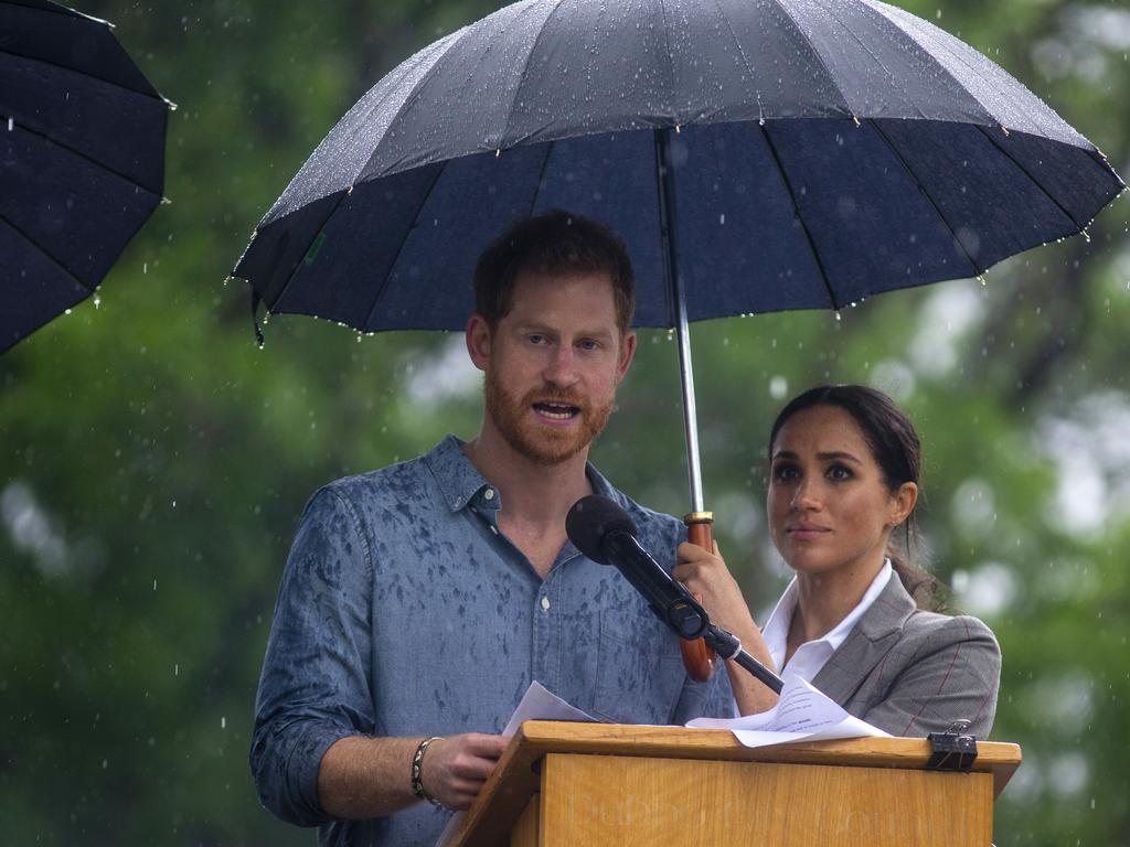 Find yourself a partner who holds your umbrella for you. Picture: Ian Vogler/AP.