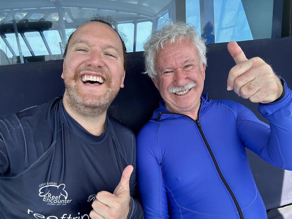 Nicholas Meyer with his father, Adrian Meyer aboard the Reef Experience tour boat near Cairns on Monday, November 20, 2023.