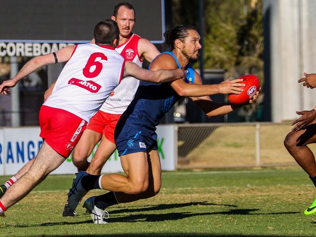 Cameron Ilett evades a nest of Demons last week. Picture: Charlie Lowson