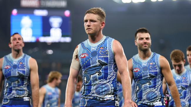 MELBOURNE, AUSTRALIA - MAY 21: Jack Ziebell of the Kangaroos (C) looks dejected following the round 10 AFL match between the North Melbourne Kangaroos and the Melbourne Demons at Marvel Stadium on May 21, 2022 in Melbourne, Australia. (Photo by Graham Denholm/Getty Images)