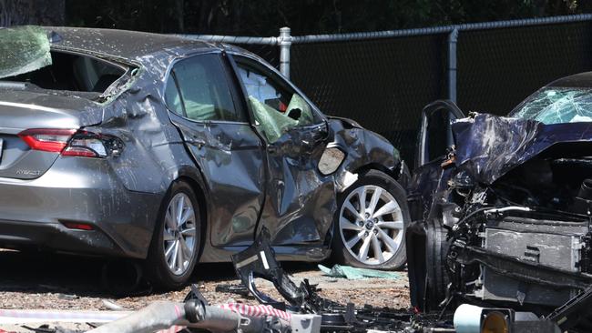 The blue Audi allegedly hit a stationary sedan after the fatal crash. Picture: Lachie Millard