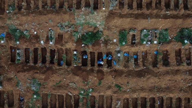 Gravediggers at work in the Vila Formosa Cemetery, on the outskirts of Sao Paulo, Brazil. Picture: AFP