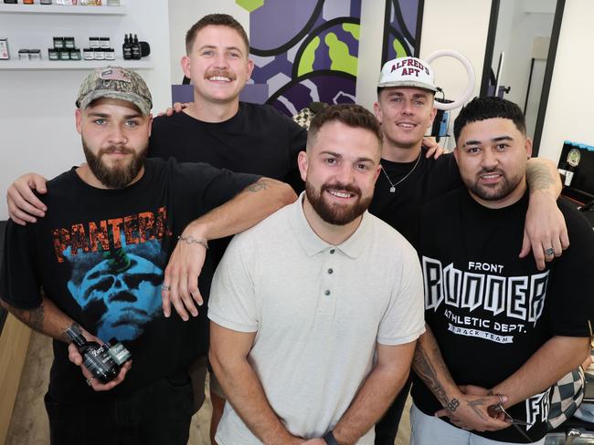 Backbone Barbershop in Currumbin has won the Bulletin's best barber on the Gold Coast competition. Owner Sam Squires (white top) and crew happy about the win. Picture Glenn Hampson