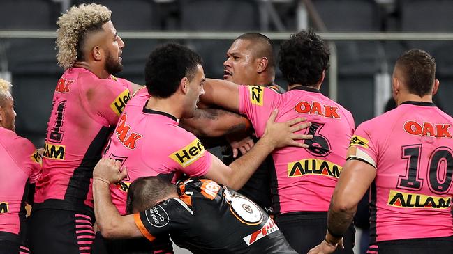 Panthers players swarm around Joey Leilua after his shot on Dyland Edwards. Picture: Getty Images