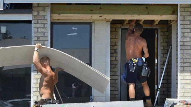 MOVING IN: Builders keep busy at Golf Links Estate at Leichhardt as the first three stages released a year ago sell out. Picture: Rob Williams