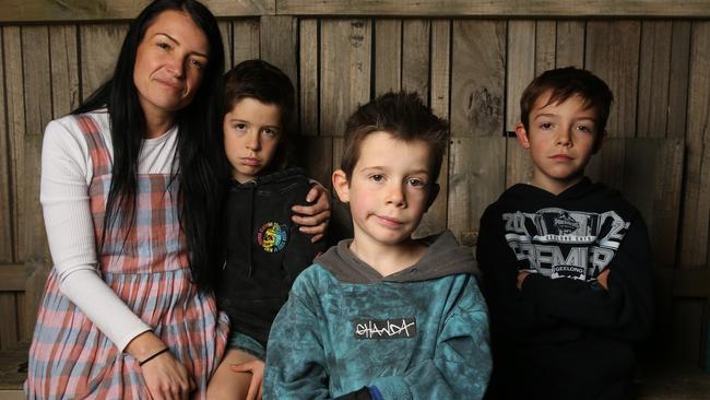 Malu Hunt (centre) with mum Erin and his brothers Harlan and Jarvie. Picture: Alan Barber