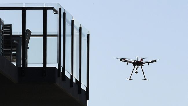 A drone operates near a balcony of an apartment in the Gold Coast Commonwealth Games Athletes Village . (AAP Image)