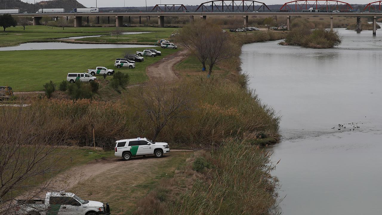 Law enforcement and border patrol vehicles line the banks of the Rio Grande. Picture: Joe Raedle/Getty Images