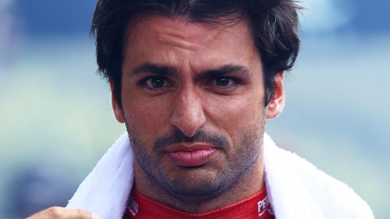 SPA, BELGIUM - JULY 28: Carlos Sainz of Spain and Ferrari walks to the grid prior to the F1 Grand Prix of Belgium at Circuit de Spa-Francorchamps on July 28, 2024 in Spa, Belgium. (Photo by Mark Thompson/Getty Images)