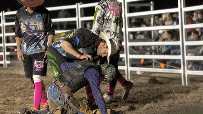 The 13 year-old girl was helped by some rodeo clowns after the fall and walked out of the ring on her own on Saturday, June 12, at Tabulam. Photo: Daniel Cohen - dcsportsphoto.com.au