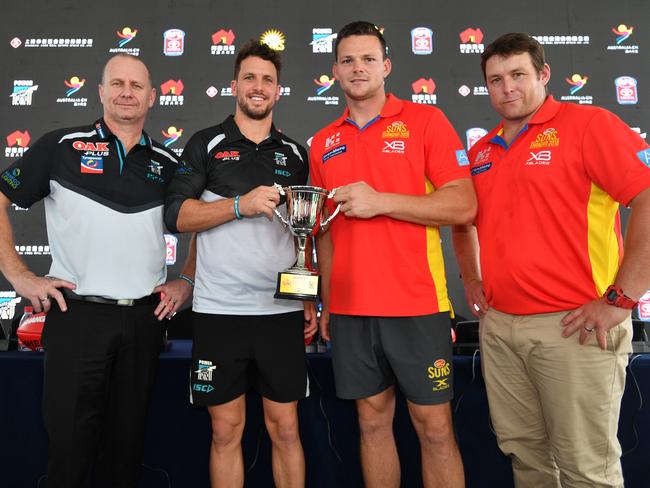 (L-R) Port Adelaide Power coach Ken Hinkley, Port Adelaide Power player Travis Boak, Gold Coast Suns player Steven May and Gold Coast Suns coach Stuart Dew pose for a photograph during a press conference at the Australia Hub, in Shanghai, China, Thursday, May 17, 2018. The Suns and the Power play on Saturday at Jiangwan Stadium in a rematch of last year's inaugural fixture. (AAP Image/David Mariuz) NO ARCHIVING