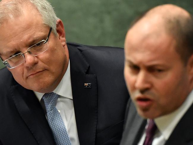 CANBERRA, AUSTRALIA - JUNE 12: Prime Minister Scott Morrison listens as Treasurer Josh Frydenberg speaks at the despatch box during Question Time in the House of Representatives at Parliament House on June 12, 2020 in Canberra, Australia. The government last month promisedÃÂ to repay $720m to 373,000 past and present welfare recipients over 470,000 unlawful demands for money calculated using faulty income averaged annual pay data as part of Centrelinks income compliance program. New polling has showed significant support for a royal commission into the debacle, and revelations that internal estimates have shown the total value of those 470,000 unlawful debts will be close to $1.5bn AUD.  (Photo by Sam Mooy/Getty Images)