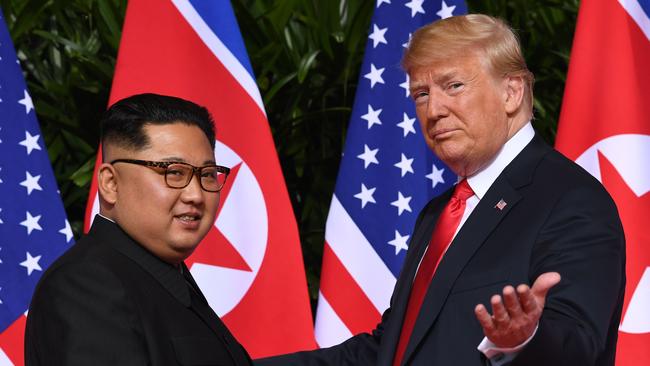 Donald Trump and North Korean leader Kim Jong-un at the start of their historic US-North Korea summit in Singapore in 2018. Picture: AFP