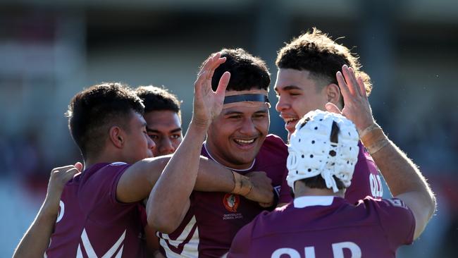 QLD's Arama Hau celebrates his try with teammates during the under 18 ASSRL schoolboy rugby league championship grand final between QLD v NSW CHS from Moreton Daily Stadium, Redcliffe. Picture: Zak Simmonds