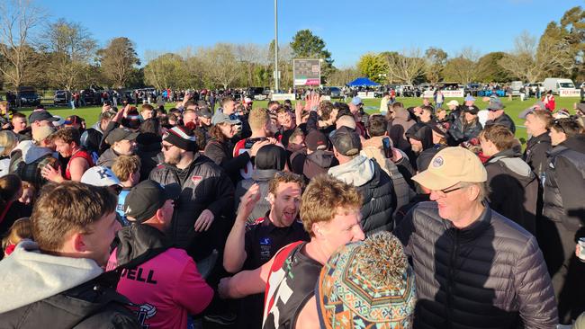 Riddell players and fans celebrate after the final siren.