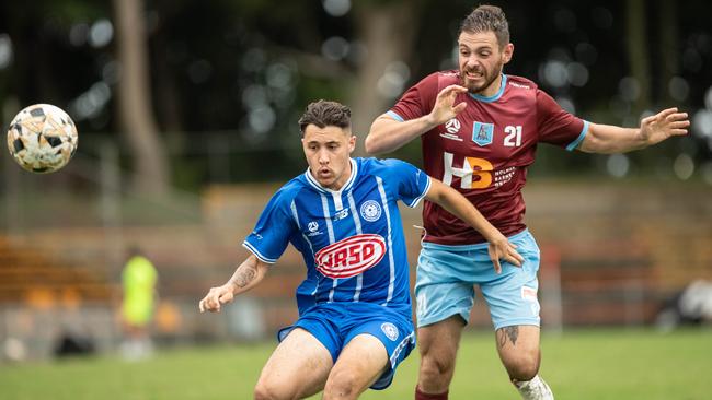 Michael Kouta of APIA Leichhardt against Olympic’s Michael Vakis. Picture: Julian Andrews