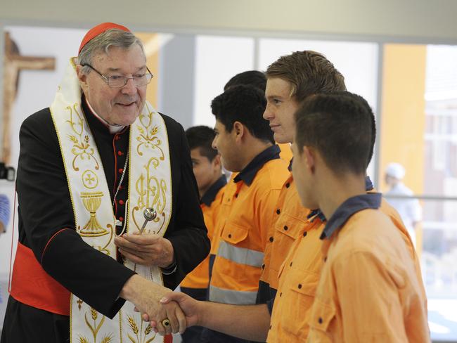 Cardinal George Pell greets future tradesmen at the opening of the Saint Yon Trade Training Centre at La Salle College Bansktown in 2014.