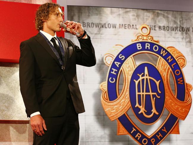 Matt Priddis drinks to his surprise Brownlow win. Picture: Wayne Ludbey